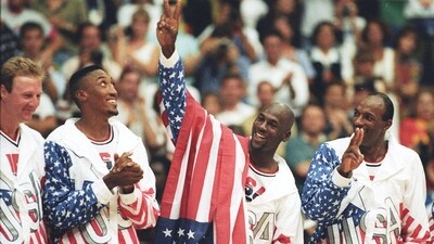 US basketball player Michael Jordan flashes a victory sign as he stands with team mates after winning the Olympic gold in Barcelona, Spain on August 8, 1992. (REUTERS)