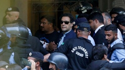 Security officers escort Pakistan's former Prime Minister Imran Khan, as he appeared in Islamabad High Court, Islamabad, Pakistan. (REUTERS file)