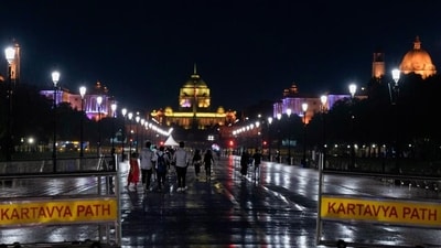 People walk during rains at Kartavya Path, in New Delhi on Thursday. (PTI) (HT_PRINT) People walk during rains at Kartavya Path, in New Delhi on Thursday. (PTI) (HT_PRINT)