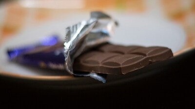 Chocolate: Chocolate contains theobromine, a compound that can be toxic to dogs. It can cause symptoms like vomiting, diarrhoea, increased heart rate, tremors, and in severe cases, it can be life-threatening. (HT Photo/Pratham Gokhale) Chocolate: Chocolate contains theobromine, a compound that can be toxic to dogs. It can cause symptoms like vomiting, diarrhoea, increased heart rate, tremors, and in severe cases, it can be life-threatening. (HT Photo/Pratham Gokhale)