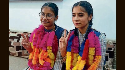 Topper Gagandeep Kaur (right) with her best friend and second rank holder Navjot Kaur, both students of Sant Mohan Dass Memorial Senior Secondary School, Kot Sukhia, Faridkot, are all smiles after the PSEB Class 10 results on Friday. (HT Photo)