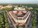 A view of the new Parliament building and the old Parliament building in New Delhi ahead of launch on Sunday.