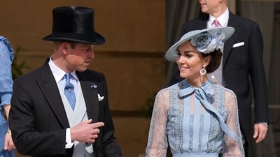 Britain's Prince William, Prince of Wales (L) and Britain's Catherine, Princess of Wales attend a Garden Party at Buckingham Palace in London on May 9, 2023, as part of the Coronation celebrations. King Charles III thanked the British people for "the greatest possible coronation gift" on Monday as three days of celebrations for the historic event drew to a close with a massive volunteering drive. (AFP)