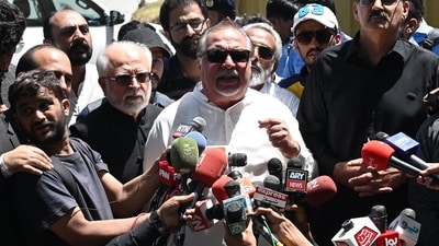 Imran Ismail (C), former governor Sindh province of the Pakistan Tehreek-e-Insaf (PTI) party speaks with media representatives in Islamabad. (AFP)