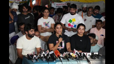 Protesting wrestlers Bajrang Punia, Vinesh Phogat and Sakshi Malik during a press conference at Jantar Mantar in New Delhi on Saturday. (PTI) Protesting wrestlers Bajrang Punia, Vinesh Phogat and Sakshi Malik during a press conference at Jantar Mantar in New Delhi on Saturday. (PTI)
