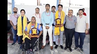 Shri Mata Vaishno Devi Shrine Board CEO Anshul Garg with medallists of Para Archery World Ranking Tournament in Jammu on Saturday. (HT Photo)