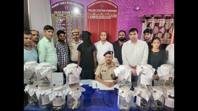 The police with the seized weapons in Gurugram on Saturday. (HT photo) The police with the seized weapons in Gurugram on Saturday. (HT photo)