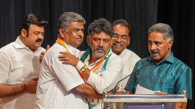 Karnataka Congress president D.K. Shivakumar with party leader B.K. Hariprasad during celebrations after the party's win in Karnataka Assembly elections, in Bengaluru. (PTI) Karnataka Congress president D.K. Shivakumar with party leader B.K. Hariprasad during celebrations after the party's win in Karnataka Assembly elections, in Bengaluru. (PTI)