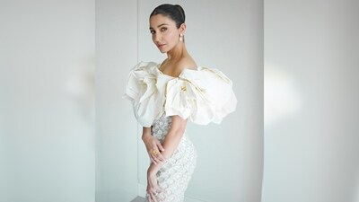 Anushka Sharma wore an ivory off-shoulder gown with dramatic sleeves, a creation of designer Richard Quinn. (Instagram/@anushkasharma) Anushka Sharma wore an ivory off-shoulder gown with dramatic sleeves, a creation of designer Richard Quinn. (Instagram/@anushkasharma)