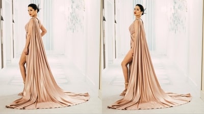 Sunny Leone looked absolutely stunning in a Naja Saade satin cut-out gown with wrap details, featuring a thigh-high slit and a striking shoulder brooch, creating an enchanting red carpet look. (Instagram/@sunnyleone ) Sunny Leone looked absolutely stunning in a Naja Saade satin cut-out gown with wrap details, featuring a thigh-high slit and a striking shoulder brooch, creating an enchanting red carpet look. (Instagram/@sunnyleone )