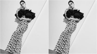 Her gown showcases a captivating black shade adorned with intricate hand-crafted white sequin embroidery arranged in a checkered pattern, along with taffeta roses. The dress boasts an off-shoulder design with necklines accentuated by large black roses. (Instagram/@kritisanon) Her gown showcases a captivating black shade adorned with intricate hand-crafted white sequin embroidery arranged in a checkered pattern, along with taffeta roses. The dress boasts an off-shoulder design with necklines accentuated by large black roses. (Instagram/@kritisanon)