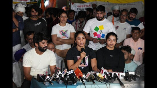Protesting wrestlers Bajrang Punia, Vinesh Phogat and Sakshi Malik during a press conference at Jantar Mantar in New Delhi on Saturday. (PTI)