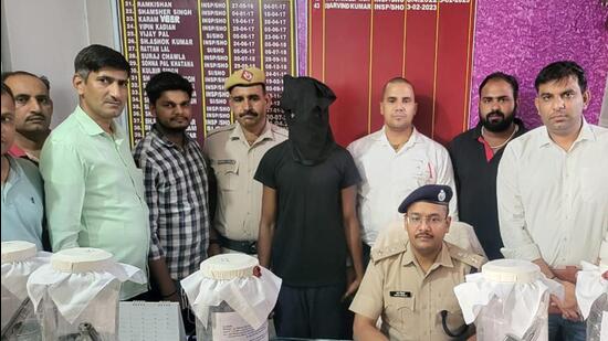 The suspect in police custody on Saturday. (HT Photo)