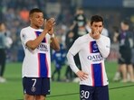 Paris St Germain's Kylian Mbappe and Lionel Messi celebrate after winning Ligue 1 