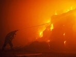 This photograph shows a rescuer putting out a fire in a building as a result of falling debris after a massive drone attack targetting Kyiv. This photograph shows a rescuer putting out a fire in a building as a result of falling debris after a massive drone attack targetting Kyiv.