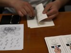 An election representative checks a stamp at a polling station in Istanbul, Turkey. An election representative checks a stamp at a polling station in Istanbul, Turkey.