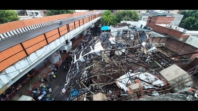 A rooftop hoarding crashed over a house in Lal Kuan in Lucknow during a storm on Saturday. (HT)