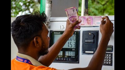 An employee checks ₹2000 currency notes given by customers at a petrol pump in Gurugram. (PTI) An employee checks ₹2000 currency notes given by customers at a petrol pump in Gurugram. (PTI)
