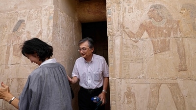 Japanese Ambassador to Egypt Oka Hiroshi (R) visits an ancient tomb in the Saqqara necropolis south of Cairo, where archaeologists unearthed two human and animal embalming workshops, as well as two tombs. The head of Egypt's Supreme Council of Antiquities, told reporters the embalming workshops, where humans and animals were mummified, "date back to the 30th dynasty" which reigned around 2,400 years ago. (Photo by Khaled DESOUKI / AFP) Japanese Ambassador to Egypt Oka Hiroshi (R) visits an ancient tomb in the Saqqara necropolis south of Cairo, where archaeologists unearthed two human and animal embalming workshops, as well as two tombs. The head of Egypt's Supreme Council of Antiquities, told reporters the embalming workshops, where humans and animals were mummified, "date back to the 30th dynasty" which reigned around 2,400 years ago. (Photo by Khaled DESOUKI / AFP)