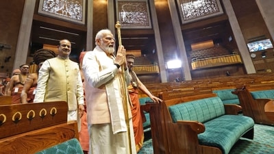 Prime Minister Narendra Modi carrying the Sengol, a Tamil sceptre during the inauguration ceremony of the new parliament building in New Delhi. (AFP) Prime Minister Narendra Modi carrying the Sengol, a Tamil sceptre during the inauguration ceremony of the new parliament building in New Delhi. (AFP)
