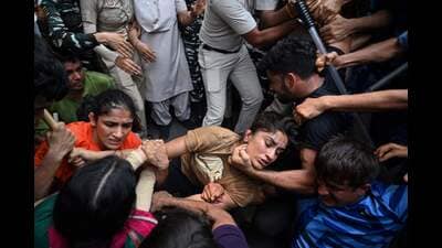 Indian wrestlers Sangeeta Phogat (L), and Vinesh Phogat (C) during a protest , in New Delhi. (AFP) Indian wrestlers Sangeeta Phogat (L), and Vinesh Phogat (C) during a protest , in New Delhi. (AFP)