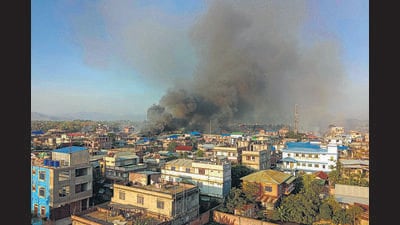 Smoke billows from a fire that broke out amid clashes between armed groups and security forces in Manipur on Sunday. (PTI) Smoke billows from a fire that broke out amid clashes between armed groups and security forces in Manipur on Sunday. (PTI)