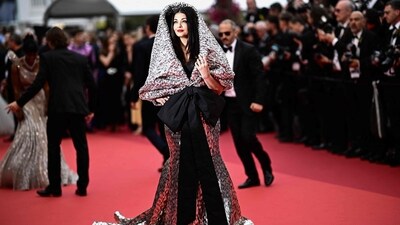 Cannes Film Festival would have been incomplete without Aishwarya Rai. The actor, who is a regular at Cannes, made only one red carpet appearance this year. Her look – a dramatic silver gown with a silver hood and black bow – divided the internet. Some praised her confidence and said she could carry off anything, others shared funny reactions and memes on Twitter. (AFP) Cannes Film Festival would have been incomplete without Aishwarya Rai. The actor, who is a regular at Cannes, made only one red carpet appearance this year. Her look – a dramatic silver gown with a silver hood and black bow – divided the internet. Some praised her confidence and said she could carry off anything, others shared funny reactions and memes on Twitter. (AFP)