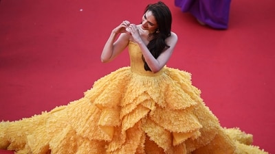 Aditi Rao Hydari turned heads in a sunshine yellow Michael Cinco ball gown at Cannes Film Festival 2023. The actor, who attended the film festival in association with Loréal Paris, was praised for her red carpet look, with some even accling it one of the best this year. (AFP) Aditi Rao Hydari turned heads in a sunshine yellow Michael Cinco ball gown at Cannes Film Festival 2023. The actor, who attended the film festival in association with Loréal Paris, was praised for her red carpet look, with some even accling it one of the best this year. (AFP)