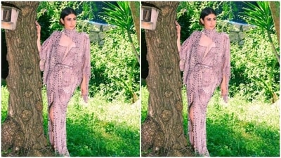 Mouni looked droolworthy in the georgette gown decorated in silver sequin details throughout, featuring dramatic full sleeves, a plunging cut-out neckline, and a thigh high slit in the middle. (Instagram/@imouniroy) Mouni looked droolworthy in the georgette gown decorated in silver sequin details throughout, featuring dramatic full sleeves, a plunging cut-out neckline, and a thigh high slit in the middle. (Instagram/@imouniroy)