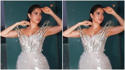 Nushrratt looked just too glam in the white short dress with silver sequin details, off-shoulder patterns, and a dramatic silver sequined bodice reaching her shoulders. (Instagram/@nushrrattbharuccha) Nushrratt looked just too glam in the white short dress with silver sequin details, off-shoulder patterns, and a dramatic silver sequined bodice reaching her shoulders. (Instagram/@nushrrattbharuccha)