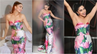 Sharvari once again proved her style prowess at the glamorous IIFA Rocks 2023 event, leaving everyone in awe. Dressed in a stunning strapless floral printed gown, she effortlessly embraced the viral "Barbie" core trend. Her presence exuded confidence and glamour, captivating her fans and leaving them utterly mesmerized. With her impeccable fashion choices, Sharvari established herself as the epitome of a true fashionista, effortlessly mastering the art of elegance and grace. (Instagram/@sharvari) Sharvari once again proved her style prowess at the glamorous IIFA Rocks 2023 event, leaving everyone in awe. Dressed in a stunning strapless floral printed gown, she effortlessly embraced the viral "Barbie" core trend. Her presence exuded confidence and glamour, captivating her fans and leaving them utterly mesmerized. With her impeccable fashion choices, Sharvari established herself as the epitome of a true fashionista, effortlessly mastering the art of elegance and grace. (Instagram/@sharvari)
