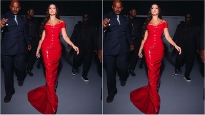 Nora's crimson red latex gown boasted a plunging neckline, off-shoulder design, figure-hugging fit, and a floor-length hem. To enhance her appearance, she paired the gown with a red bralette with thin straps, adding an extra touch of allure.&nbsp; (Instagram/@norafatehi)