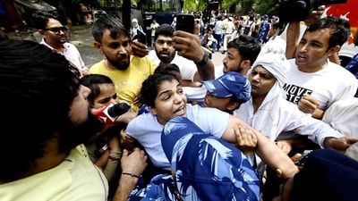 Wrestler Sakshi Malik being pulled by security forces. Malik shared a video of the police detaining her fellow wrestlers and said that “This is how our champions are being treated”. (Sanjeev Verma/ Hindustan Times) Wrestler Sakshi Malik being pulled by security forces. Malik shared a video of the police detaining her fellow wrestlers and said that “This is how our champions are being treated”. (Sanjeev Verma/ Hindustan Times)