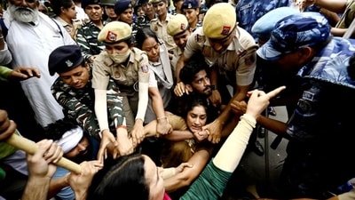 Ace wrestlers Vinesh Phogat, Sakshi Mallik and Bajrang Punia were among others who were detained by Delhi Police on Sunday while attempting to march to the new Parliament building where they planned to stage a demonstration. (Sanjeev Verma/ Hindustan Times) Ace wrestlers Vinesh Phogat, Sakshi Mallik and Bajrang Punia were among others who were detained by Delhi Police on Sunday while attempting to march to the new Parliament building where they planned to stage a demonstration. (Sanjeev Verma/ Hindustan Times)