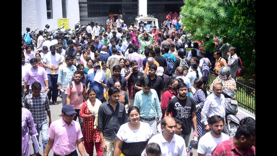 Candidates at an exam centre in Lucknow on Sunday. (Deepak Gupta/ht)