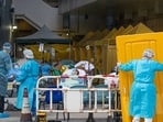 Patients displaying Covid-19 symptoms at a temporary triage area next to the emergency department at the Caritas Medical Center hospital in Hong Kong, Patients displaying Covid-19 symptoms at a temporary triage area next to the emergency department at the Caritas Medical Center hospital in Hong Kong,