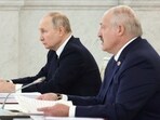 Russian President Vladimir Putin and Belarusian President Alexander Lukashenko attend a meeting.