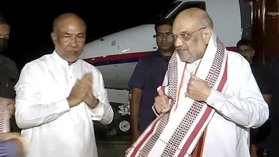 Union Home Minister Amit Shah is being welcomed by Manipur Chief Minister N.Biren Singh as he arrives to hold a series of meetings with various stakeholders of the state, in Imphal on Monday. (N Biren Singh Twitter) Union Home Minister Amit Shah is being welcomed by Manipur Chief Minister N.Biren Singh as he arrives to hold a series of meetings with various stakeholders of the state, in Imphal on Monday. (N Biren Singh Twitter)