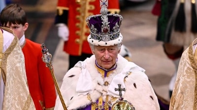 Britain's King Charles III wearing the Imperial state Crown leaves Westminster Abbey after the Coronation Ceremonies. (AFP) Britain's King Charles III wearing the Imperial state Crown leaves Westminster Abbey after the Coronation Ceremonies. (AFP)