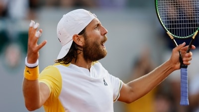 France's Lucas Pouille reacts after missing a shot against Austria's Jurij Rodionov during their first round match of the French Open tennis tournament (AP)