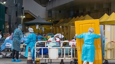 Patients displaying Covid-19 symptoms at a temporary triage area next to the emergency department at the Caritas Medical Center hospital in Hong Kong, (Bloomberg)