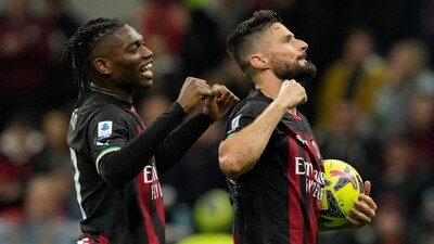 AC Milan's Olivier Giroud, right, celebrates with bis teammate Rafael Leao after scoring his side's fifth goal during the Serie A soccer match between AC Milan and Sampdoria at the San Siro stadium, in Milan, Italy, Saturday, May 20, 2023. (AP Photo/Antonio Calanni) (AP) AC Milan's Olivier Giroud, right, celebrates with bis teammate Rafael Leao after scoring his side's fifth goal during the Serie A soccer match between AC Milan and Sampdoria at the San Siro stadium, in Milan, Italy, Saturday, May 20, 2023. (AP Photo/Antonio Calanni) (AP)
