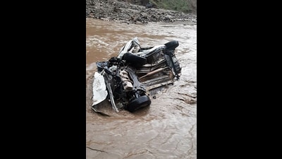 Mangled remains of a car after it fell into a gorge in Jammu and Kashmir’s Doda on Monday. Four people were killed and one injured in the accident. (ANI)
