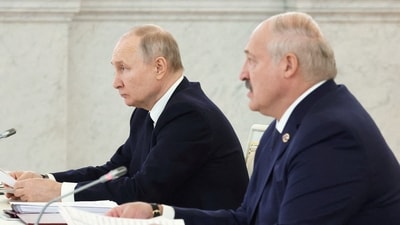 Russian President Vladimir Putin and Belarusian President Alexander Lukashenko attend a meeting. (Reuters)