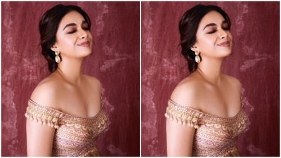 Keerthy looked like a billion bucks in a multicoloured blouse with off-shoulder details and a sweetheart neckline featuring zari patterns throughout. She further teamed it with a georgette skirt with floral patterns and zari details at the borders. In a matching dupatta, she completed her look for the day.&nbsp; (Instagram/@keerthysureshofficial)