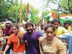 Wrestlers Bajrang Punia, Vinesh Phogat and Sangeeta Phogat along with supporters protesting against the alleged sexual harassment of women wrestlers by WFI chief Brij Bhushan Sharan Singh.