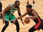 Jaylen Brown #7 of the Boston Celtics defends Jimmy Butler #22 of the Miami Heat during the fourth quarter in game seven of the Eastern Conference Finals at TD Garden on May 29, 2023 in Boston, Massachusetts.