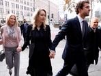 Theranos founder Elizabeth Holmes arrives with her family and partner Billy Evans to be sentenced on her convictions for defrauding investors in the blood testing startup at the federal courthouse in San Jose, California, U.S., November 18, 2022.
