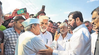 **EDS: TWITTER IMAGE VIA @mieknathshinde** Nashik: Maharashtra Chief Minister Eknath Shinde meets farmers whose crops got damaged during recent rain and hailstorm, in Nashik district, Monday, April 10, 2023. Shinde made visits to farms in Nitane, Bijjote and Akhatwade villages of the district. (PTI Photo)(PTI04_10_2023_000150B) (PTI) **EDS: TWITTER IMAGE VIA @mieknathshinde** Nashik: Maharashtra Chief Minister Eknath Shinde meets farmers whose crops got damaged during recent rain and hailstorm, in Nashik district, Monday, April 10, 2023. Shinde made visits to farms in Nitane, Bijjote and Akhatwade villages of the district. (PTI Photo)(PTI04_10_2023_000150B) (PTI)