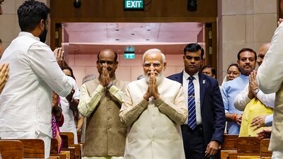 Prime Minister Narendra Modi being welcomed as he arrives in the Lok Sabha chamber of the new Parliament building in New Delhi Sunday, (PTI) Prime Minister Narendra Modi being welcomed as he arrives in the Lok Sabha chamber of the new Parliament building in New Delhi Sunday, (PTI)